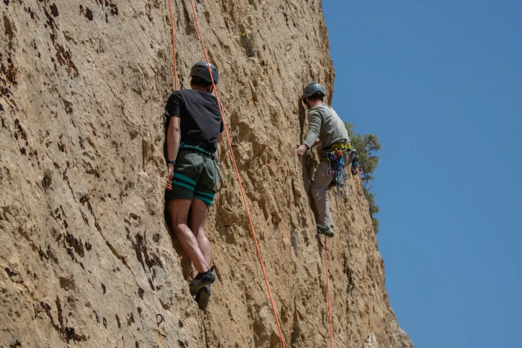 Climber ascending a limestone wall in Mallorca